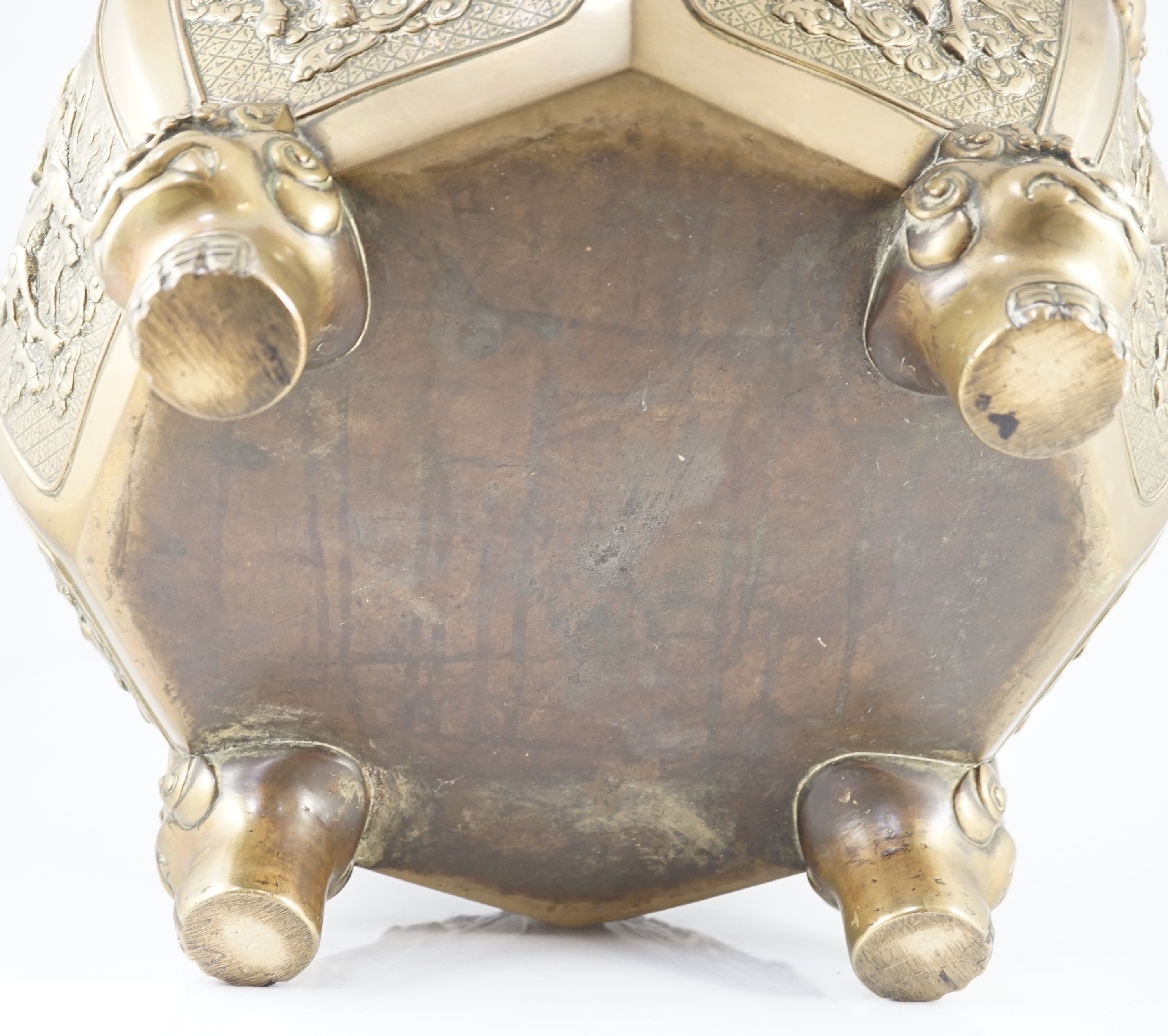 A large Chinese polished bronze octagonal jardiniere, 19th century, 48cm wide at handles, slight faults